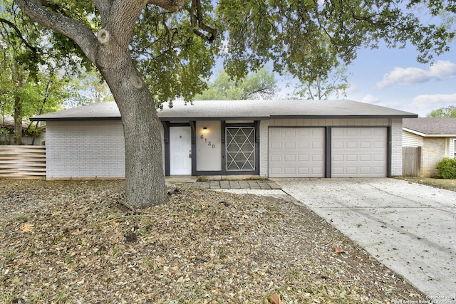 ranch-style home with a garage