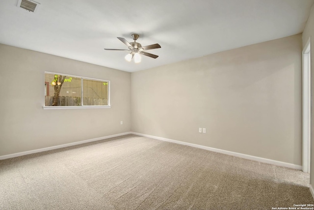 empty room featuring carpet flooring and ceiling fan