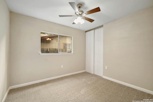 unfurnished bedroom featuring carpet flooring and ceiling fan