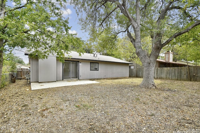 back of property featuring a patio