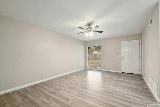 empty room featuring light hardwood / wood-style floors and ceiling fan