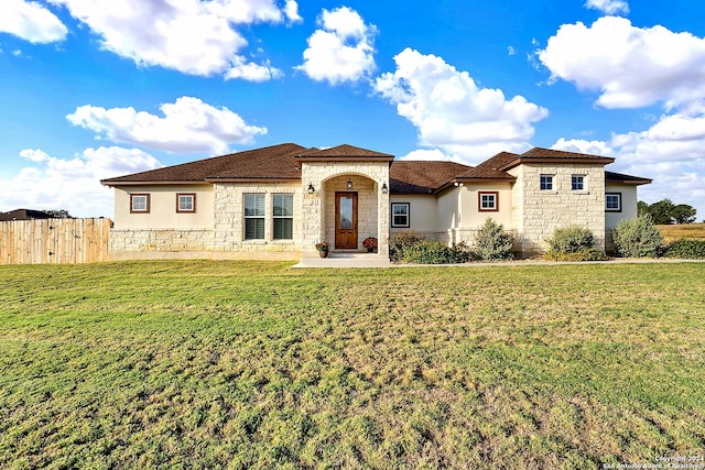 view of front of property with a front lawn