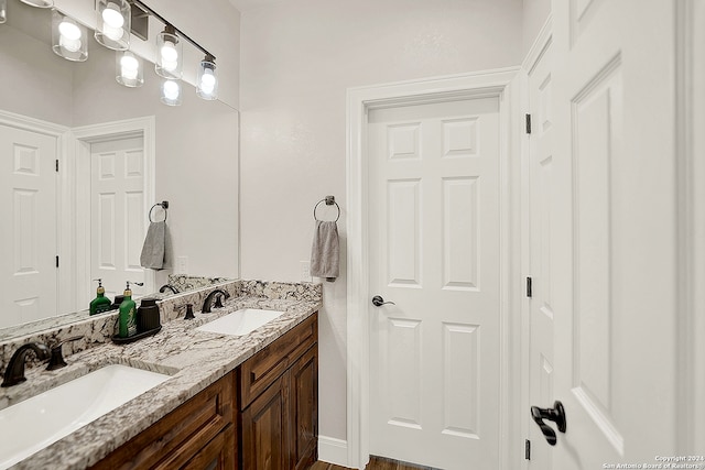 bathroom featuring vanity and hardwood / wood-style flooring