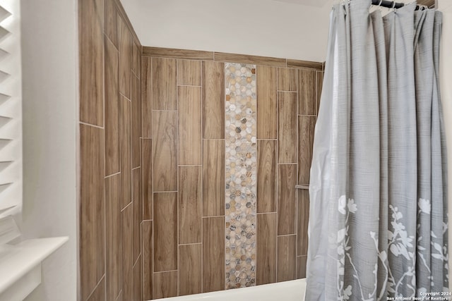 bathroom with a shower with shower curtain