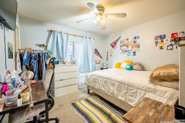 bedroom with ceiling fan and carpet floors