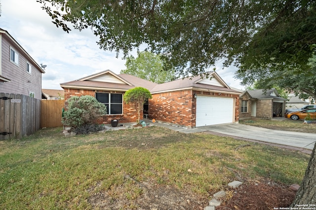 ranch-style home with a garage and a front yard