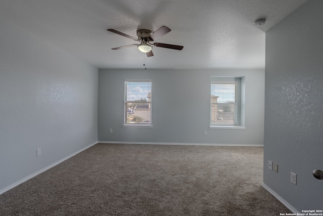 unfurnished room featuring ceiling fan, a textured ceiling, and carpet floors