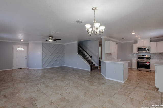 kitchen with appliances with stainless steel finishes, ceiling fan with notable chandelier, white cabinetry, decorative light fixtures, and ornamental molding