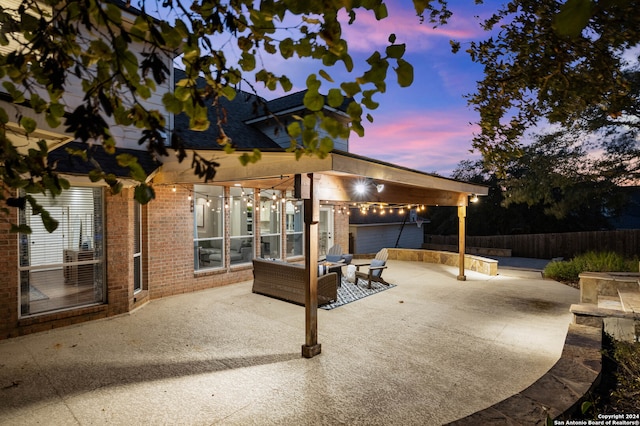 view of patio terrace at dusk