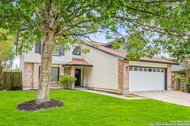 view of front of home featuring a front yard and a garage