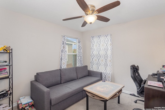 office space featuring ceiling fan and light colored carpet