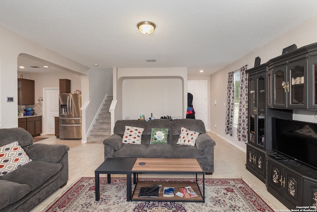 tiled living room with a textured ceiling