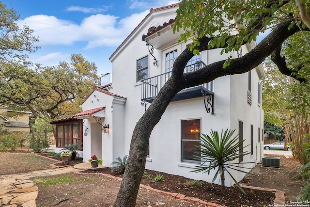 view of property exterior with cooling unit