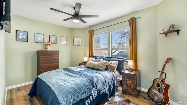 7935 Sonny Rdg, San Antonio, TX 78244 - bedroom featuring wood finished floors, baseboards, and a ceiling fan