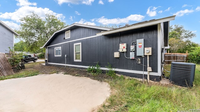 view of side of property with central AC unit