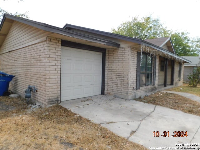 view of side of property featuring a garage