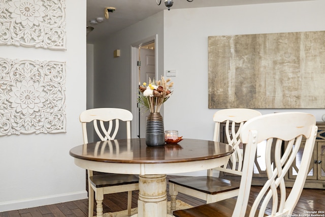 dining room with dark hardwood / wood-style floors