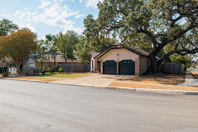 ranch-style house featuring a garage