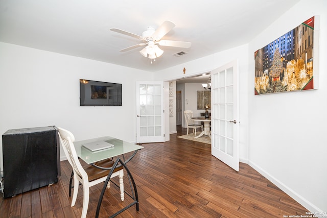 office space featuring french doors, ceiling fan, and dark wood-type flooring