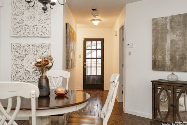 entryway with dark hardwood / wood-style flooring