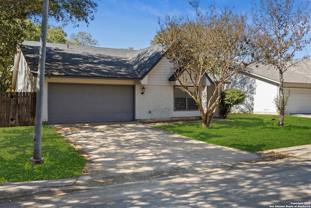 ranch-style house featuring a front lawn and a garage