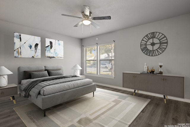 bedroom featuring dark hardwood / wood-style floors and ceiling fan