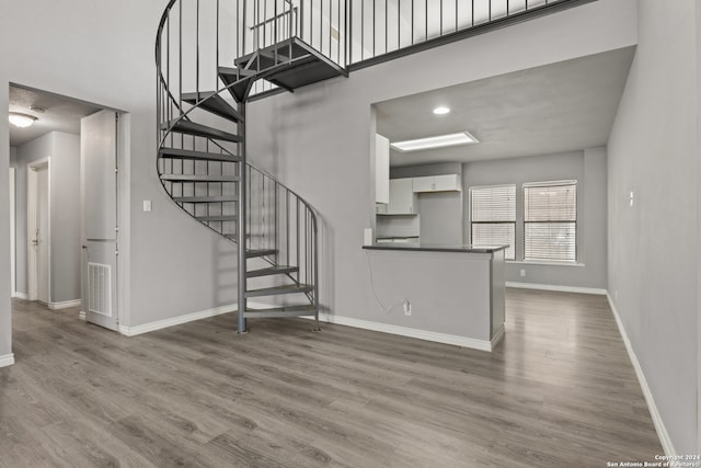 unfurnished living room featuring hardwood / wood-style floors