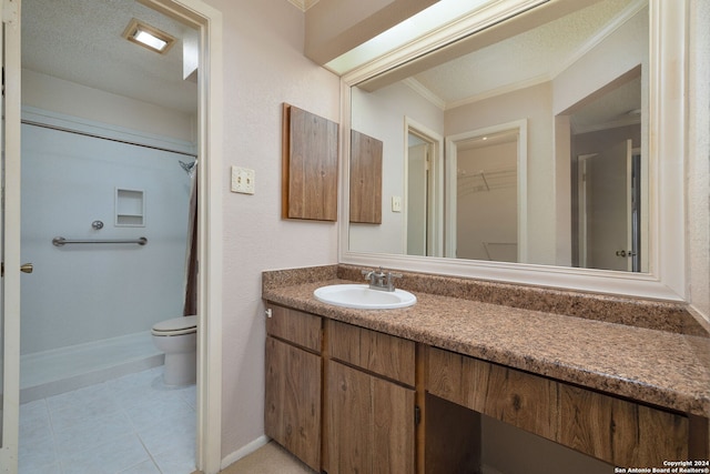 bathroom featuring vanity, crown molding, curtained shower, and toilet