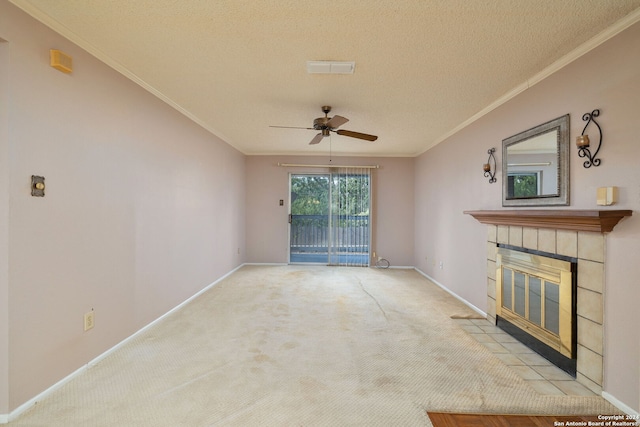 unfurnished living room with ornamental molding, light carpet, and a textured ceiling