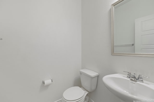 bathroom with sink and toilet