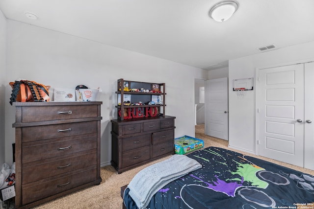 bedroom featuring light colored carpet