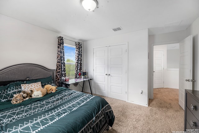 bedroom featuring a closet and carpet floors