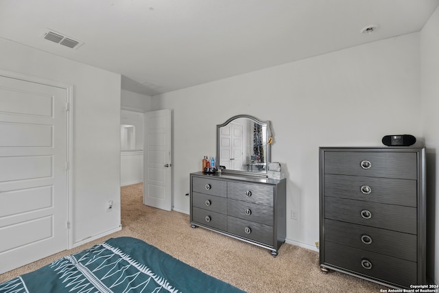 bedroom with light colored carpet