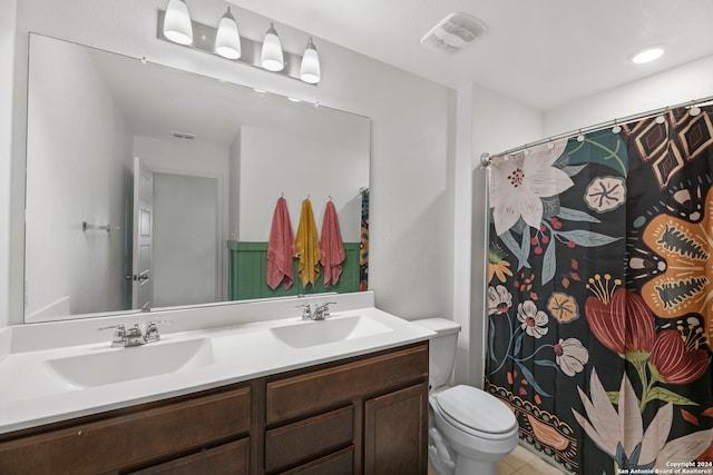 bathroom featuring vanity, a shower with shower curtain, toilet, and tile patterned flooring