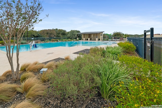 view of swimming pool featuring a patio area