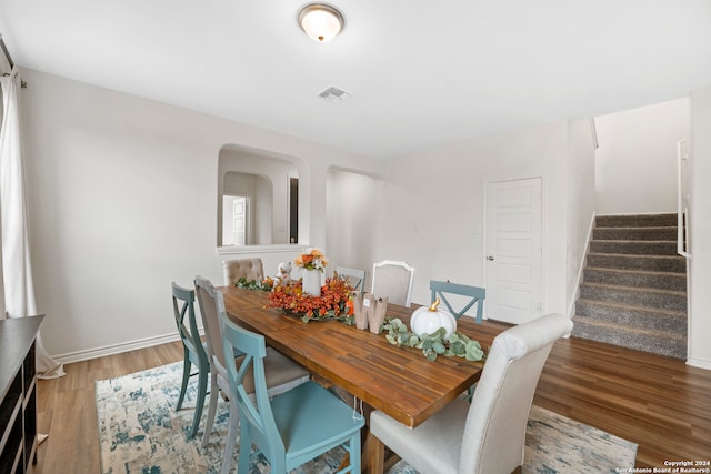 dining area featuring wood-type flooring