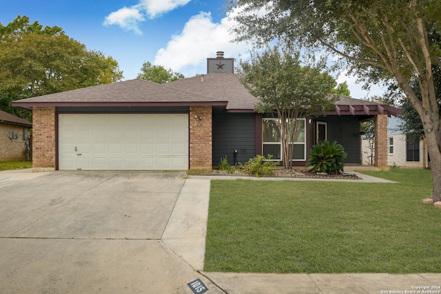 view of front facade featuring a front lawn and a garage