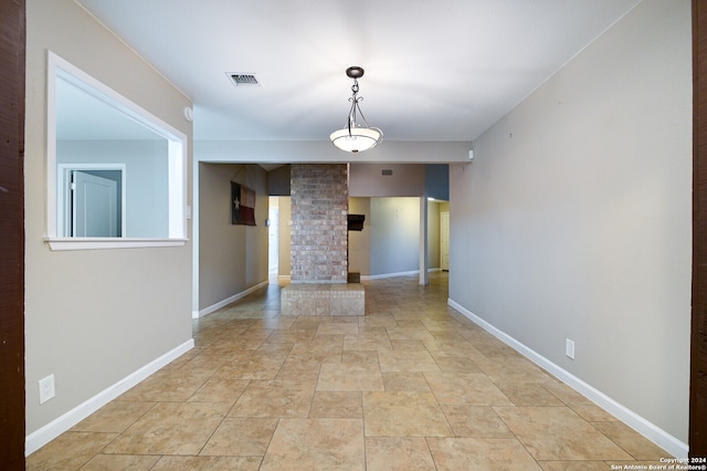 unfurnished room with ornate columns