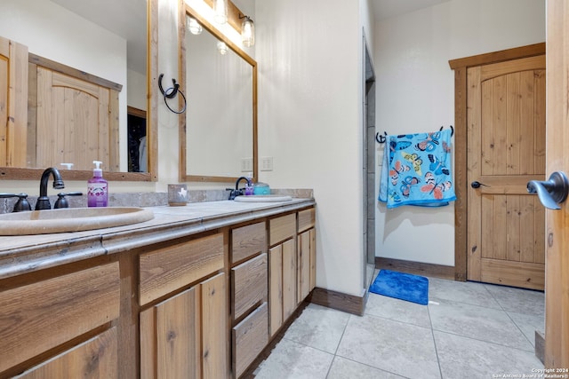 bathroom with vanity and tile patterned floors