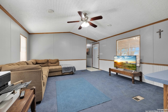 carpeted living room featuring a textured ceiling, a healthy amount of sunlight, ceiling fan, and vaulted ceiling