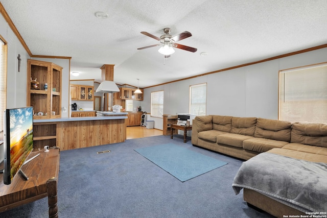 living room featuring lofted ceiling, light carpet, ornamental molding, a textured ceiling, and ceiling fan