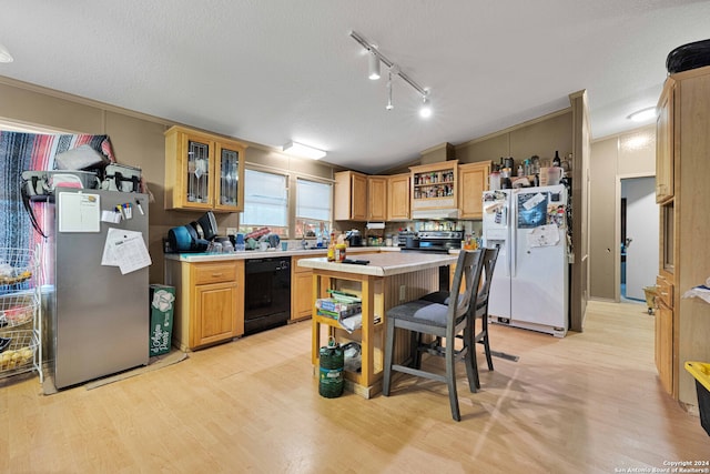 kitchen with dishwasher, white fridge with ice dispenser, stainless steel fridge, a textured ceiling, and light hardwood / wood-style floors