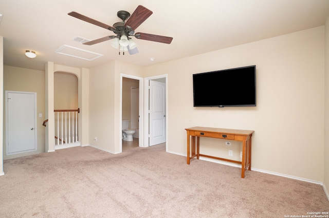 unfurnished living room featuring light carpet and ceiling fan