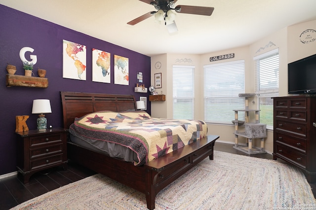 bedroom featuring dark wood-type flooring and ceiling fan