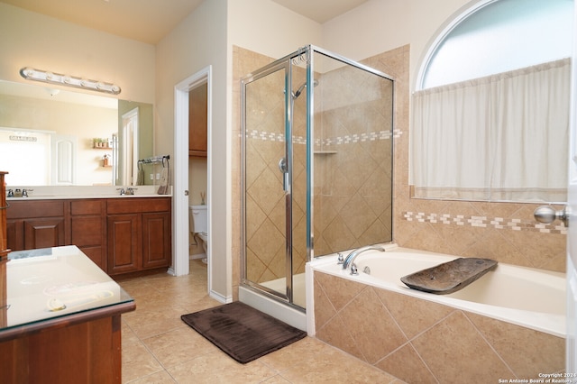 full bathroom with vanity, plus walk in shower, toilet, and tile patterned floors