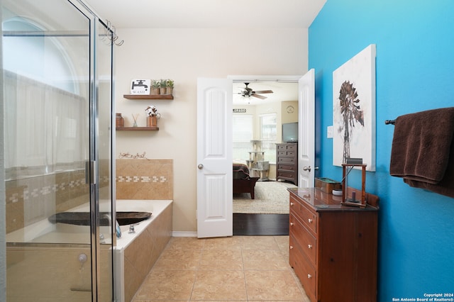 bathroom with vanity, ceiling fan, tile patterned floors, and plus walk in shower