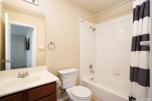 full bathroom featuring vanity, toilet, and shower / bath combo with shower curtain