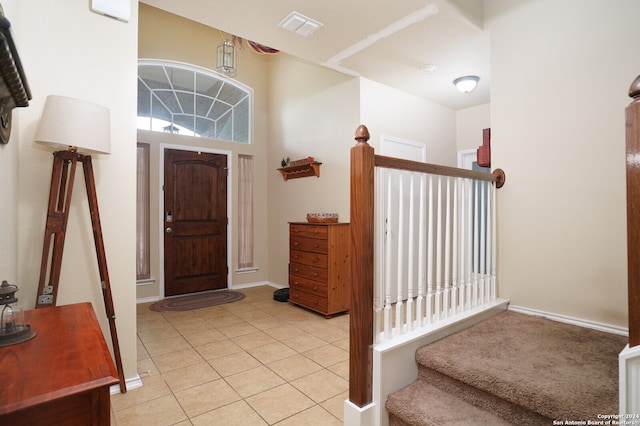 entrance foyer with light tile patterned floors