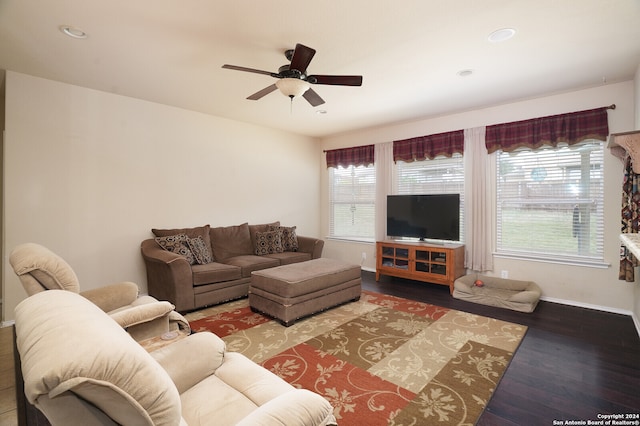 living room with ceiling fan, a healthy amount of sunlight, and dark hardwood / wood-style flooring