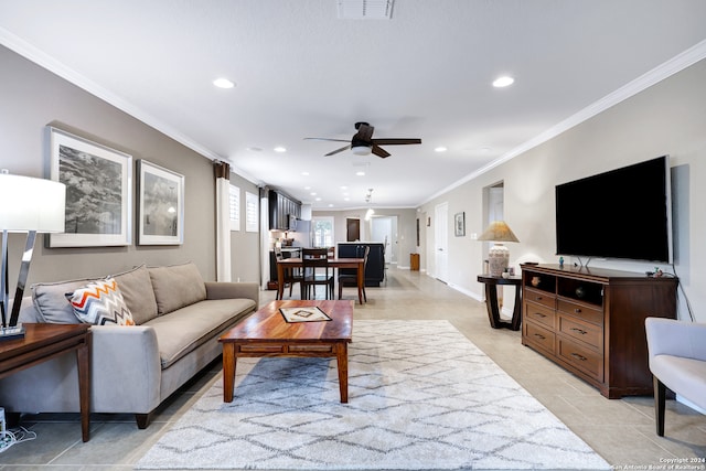 tiled living room with crown molding and ceiling fan